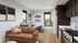 Modern studio apartment with open living area, cozy bed, stylish kitchen, and panoramic window views.
