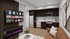 Contemporary apartment living room with modern kitchen, stylish cabinetry, cozy leather sofa, and sleek TV setup, creating an inviting atmosphere.