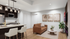 Elegant open-concept living space featuring a cozy leather sofa, modern kitchen island with seating, stylish pendant lighting, and contemporary artwork.