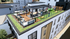 Vibrant rooftop terrace showcasing modern outdoor furniture, lush greenery, and lively social spaces perfect for relaxation and entertainment.