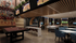 Modern entertainment room with stylish decor, featuring a pool table, trendy seating, and multiple screen displays for an immersive experience.