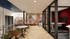 Modern communal workspace with artistic mural, sleek round tables, and elegant lighting, perfect for collaboration and creativity.