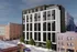 Modern urban apartment building with sleek black and white facade, featuring large windows and street-level greenery in a vibrant city setting.
