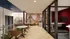 Modern and vibrant co-working space featuring colorful mural walls, sleek glass partitions, and chic seating areas.