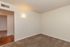 Inviting and cozy room with plush carpet and warm lighting, ideal for creating a tranquil personal space.