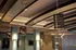Elegant lobby ceiling with modern pendant lighting and stylish design accents.