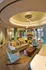 Elegant modern living room featuring a stylish ceiling design, cozy fireplace, and chic furniture, perfect for relaxation and social gatherings.