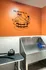 Chic pet grooming spa with vibrant orange walls and modern facilities, perfect for pampering your furry friends.