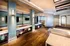 Elegant and modern lounge area featuring sleek wooden flooring, ambient lighting, and stylish decor, ideal for relaxation and social gatherings.