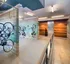 Modern indoor bike storage with sleek wall-mounted racks and bright overhead lighting.
