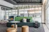 Modern lounge area with stylish seating, cozy cushions, and bright natural light creating an inviting atmosphere.