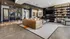 Modern living room with luxurious leather sofa, elegant shelving, and contemporary decor, perfect for stylish relaxation.
