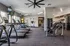 Bright, modern gym with state-of-the-art treadmills, weight machines, and vibrant exercise balls, ideal for a full workout.