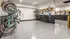 Modern bike storage room with sleek wall-mounted racks and a polished concrete floor, offering convenient and organized space for cyclists.