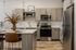 Modern kitchen with stainless steel appliances, sleek cabinetry, and a stylish island perfect for entertaining.
