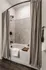 Elegant bathroom featuring a stylish tiled shower, modern fixtures, and cozy ambiance with a classic bathtub design.