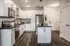 Modern kitchen with stainless steel appliances, sleek cabinetry, and a stylish center island perfect for culinary enthusiasts.