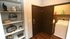 Charming apartment laundry room with stylish shelving and modern appliances, featuring decorative accents for an inviting ambiance.