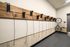 Modern apartment bicycle storage area with secure wooden wall mounts and sleek design.