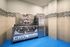 Modern pet-friendly amenity featuring a stylish dog wash station with vibrant blue flooring and playful graphics.