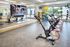 State-of-the-art fitness center featuring sleek stationary bikes, vibrant wall mirrors, and bright windows for natural light.