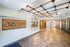 Chic and modern lobby of Riverfront District featuring stylish lighting and elegant wood accents.