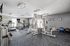 Modern fitness center featuring state-of-the-art gym equipment, including treadmills, weight machines, and exercise balls, set in a bright, motivational space.