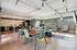 Contemporary open-concept lounge with sleek kitchen, stylish seating, and modern dining area, perfect for entertaining.