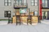Chic outdoor patio with modern wooden bar seating, perfect for entertaining in an upscale apartment complex.
