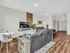 Contemporary open-concept studio apartment with sleek decor, cozy seating area, and stylish dining space.