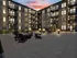Modern apartment complex courtyard at sunset with stylish outdoor seating and elegant lighting.