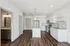 Modern kitchen with elegant granite countertops, sleek stainless steel appliances, and contemporary design in a bright, open-concept space.