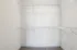 Spacious walk-in closet with ample shelving for organized storage.
