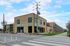 Modern apartment complex offering luxury living with 1-2 bedroom homes, featuring sleek architecture and vibrant surroundings.