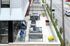 Chic rooftop terrace featuring modern outdoor furniture, vibrant cushions, and lush potted plants, perfect for relaxation and entertaining.