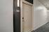Modern apartment entryway featuring a sleek door design with illuminated signage for unit 416, set in a stylish, well-lit hallway.
