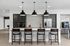 Modern kitchen with sleek cabinetry, stainless steel appliances, and an inviting breakfast bar with pendant lighting.