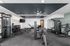 Modern fitness center with state-of-the-art gym equipment, sleek design, and ample workout space.