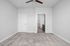 Bright, spacious bedroom with plush carpeting and en-suite bathroom, ideal for modern living.