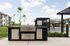 Elegant outdoor space featuring a modern stainless steel grill and inviting pool area, perfect for entertaining.