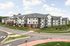 Modern, multi-story apartment complex with elegant architecture and lush green surroundings, perfect for comfortable living.