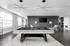 Chic entertainment room with a modern pool table, sleek lighting, and comfortable seating; ideal for luxury gatherings.