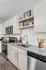 Sleek modern kitchen with stainless steel appliances, elegant granite countertops, and ample storage.