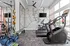 Contemporary gym area with modern fitness equipment, vibrant exercise bands, and scenic city map decor for an energetic workout atmosphere.