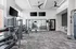 Modern fitness center boasting state-of-the-art equipment, sleek design, and ample workout space for an energizing exercise experience.
