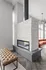Modern living space featuring a sleek double-sided fireplace, elegant light fixtures, and a cozy seating area.
