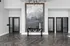Modern entryway featuring sleek herringbone wood floors, a contemporary black console table, and artistic wall decor.
