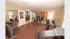 Modern indoor fitness center with weight equipment, cardio machines, and natural lighting.