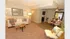 Inviting living space featuring a cozy sofa, modern decor, and a stylish open dining area, perfect for entertaining.