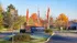 Welcoming entrance to The Brixton Apartments with vibrant autumn foliage and elegant signage.